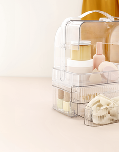 Bærbart sminkeskrin med skuffer i gjennomsiktig plast