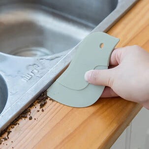 Rengjøringsskrape i plast for fuger og hjørner